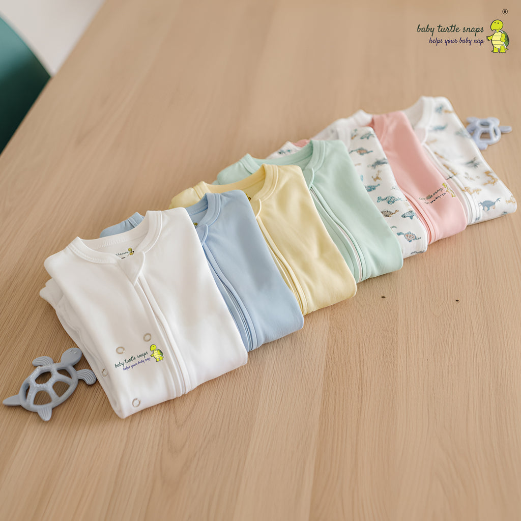Baby cotton romper showing fold-over cuffs and zipper design.